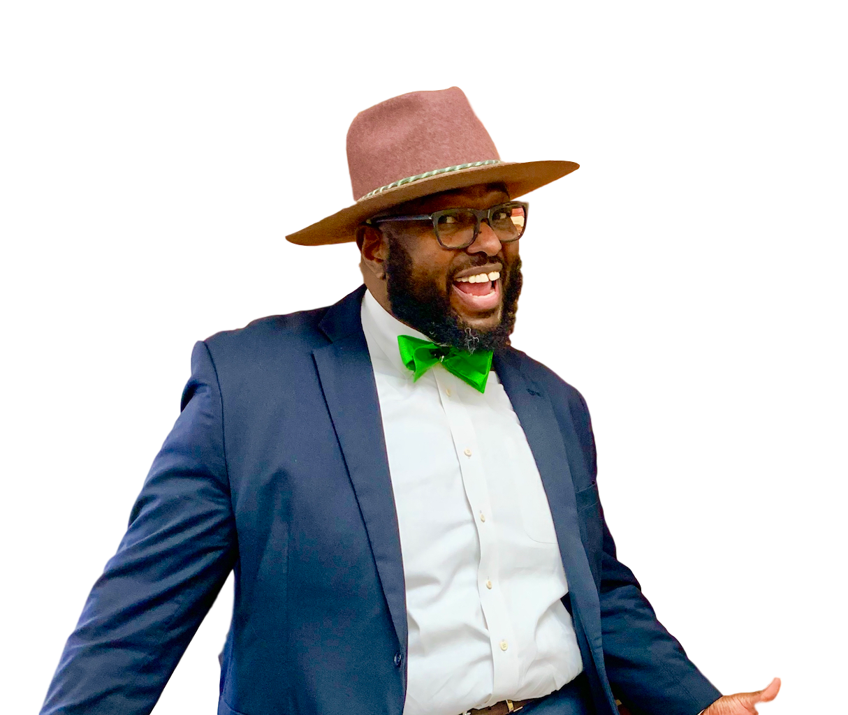 Dr. Corey J. Henderson smiling in a navy suit, green bow tie, and hat